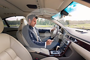 Man using cell phone while driving