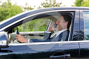 Man using cell phone while driving.