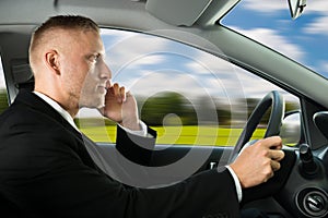 Man using cellphone while driving