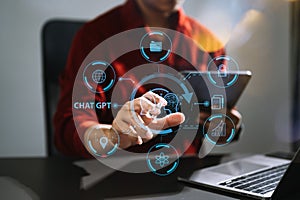 Man using chatbot in computer and tablet smart intelligence Ai.Chat GPT Chat with AI Artificial Intelligence, developed by OpenAI