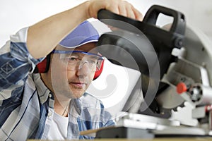 man using circular saw