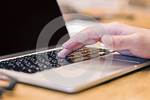 Man using clean laptop screen on desktop