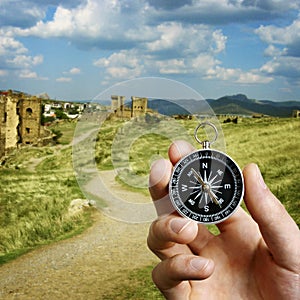 Man using a compass while sightseeing abroad