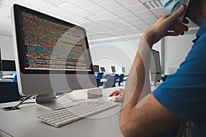 Man using a computer in a class