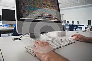 Man using a computer in a class