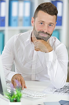 Man using computer keyboard in office