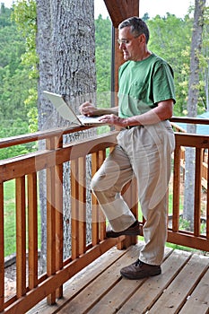 Man using computer while on vacation