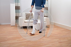 Man using crutches for walking