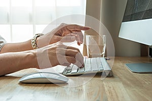 Man using desktop pc computer, mobile office concept