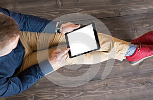 Man using digital tablet.