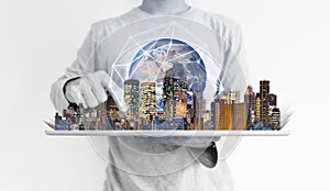 A man using digital tablet with modern building and global network connection technology hologram. Element of this image are furni photo