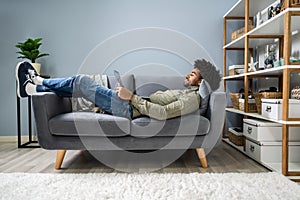 Man Using Digital Tablet On Sofa