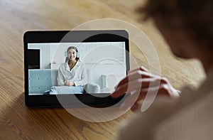 Man using digital tablet for video call with friend or coleague