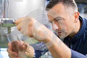 man using draught pump