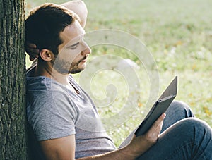 Man using e-book reader