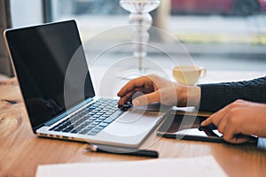 Man using empty laptop screen on desktop