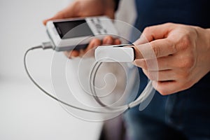 Man using finger pulse oximeter, healthcare monitoring concept. Pulse oximeter on a white background