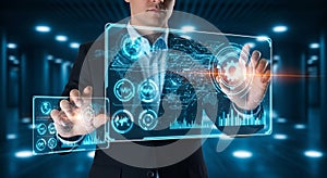 Man Using Futuristic Holographic Interface with Data Visualizations