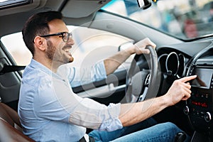 Man Using Gps Navigation System In Car to travel