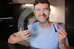 Man using his credit card to shop online