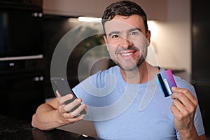 Man using his credit card to shop online