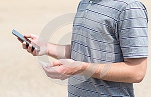 Man using his phone and holding card
