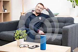 Man using home assistant bluetooth speaker