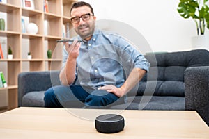 Man using home assistant bluetooth speaker