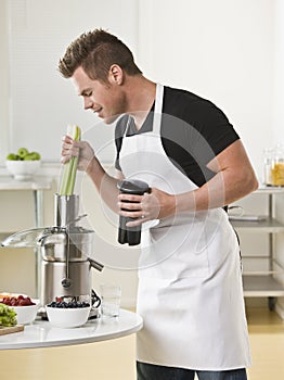 Man Using Juicer