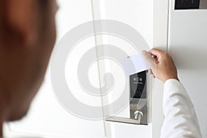 Man using keycard contactless for unlock door in hotel.