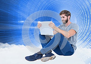 Man using laptop against digitally generated background