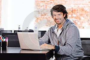 Man using laptop casual businessman smile