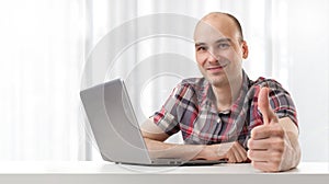 Man using laptop computer.