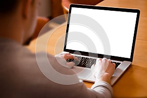 Man using laptop computer in living room photo