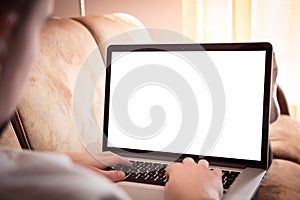 Man using laptop computer in living room