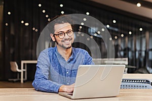 Man using laptop computer in office