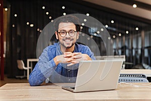 Man using laptop computer in office