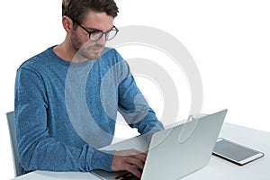 Man using laptop at desk