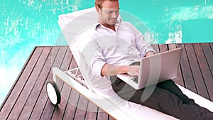 Man using laptop in the garden