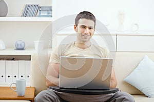 Man using laptop at home