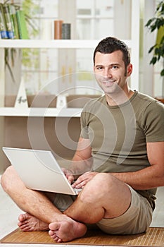 Man using laptop at home