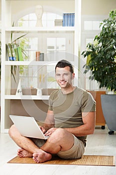 Man using laptop at home