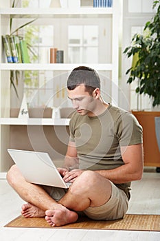 Man using laptop at home