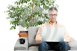 Man using laptop at home