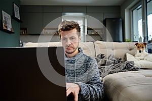 Man using laptop at living room