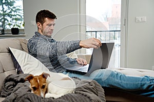 Man using laptop at living room