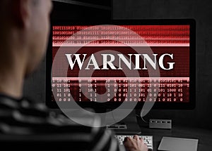 Man using laptop at night