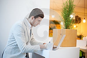Man using laptop in office