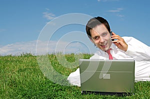 Man using laptop outdoors