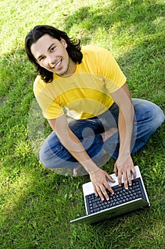 Man using laptop outdoors